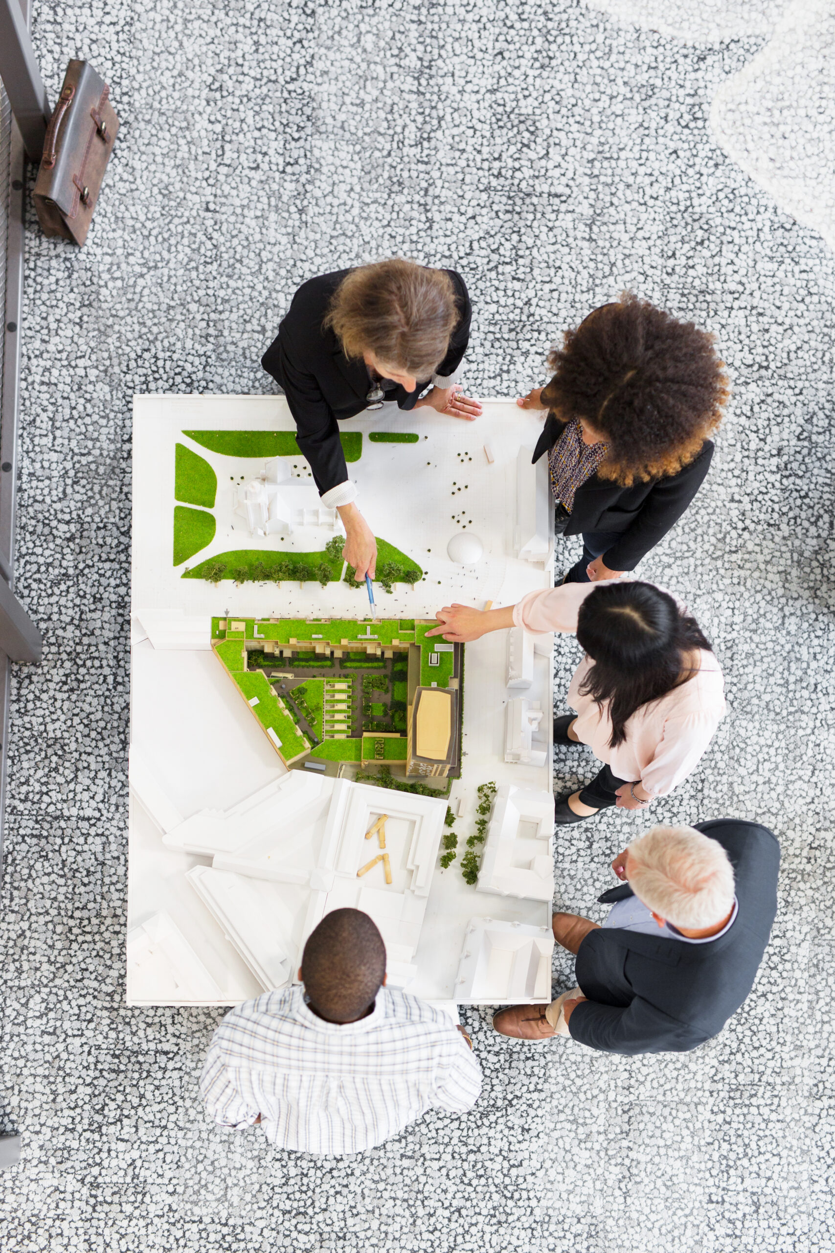 https://seencreativemarketing.com/wp-content/uploads/2025/05/overhead-view-of-architects-discussing-blueprint-2024-10-18-03-54-20-utc-scaled.jpg